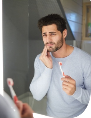 Man in pain before emergency dentistry
